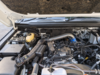 EXART Toyota Land Cruiser 250 EA04-TY147 throttle-side Air Intake Stabilizer, manufacturer engine-bay installation reference. Air-cleaner-side AIS sold separately.